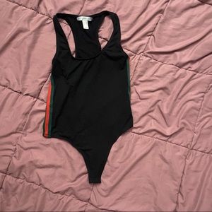 black bodysuit has green and red stripes on the side size small